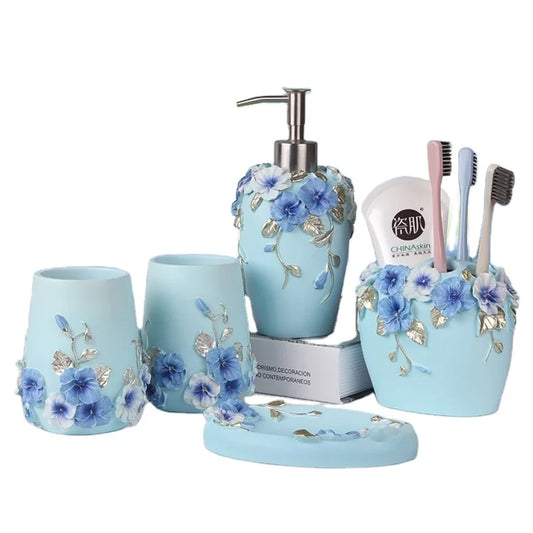 JMT-583818 Flower Pattern Polyresin Bathroom Accessory Set in Blue - Includes Lotion Dispenser, Toothbrush Holder, Soap Dish, Tumbler, Toilet Brush Holder, Amenity Tray, Tissue Cover, and Waste Bin