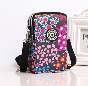 JMT-801866 Vertical Oxford Phone Bag with Zipper Closure and Multiple Floral Prints